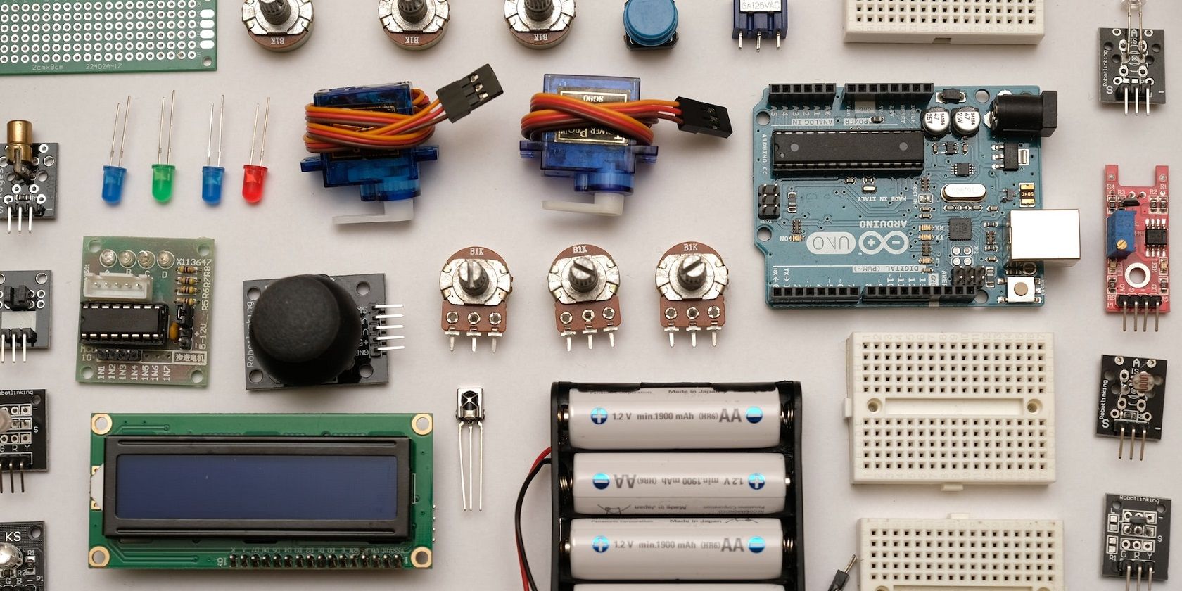 An electronics kit laid flat on a board