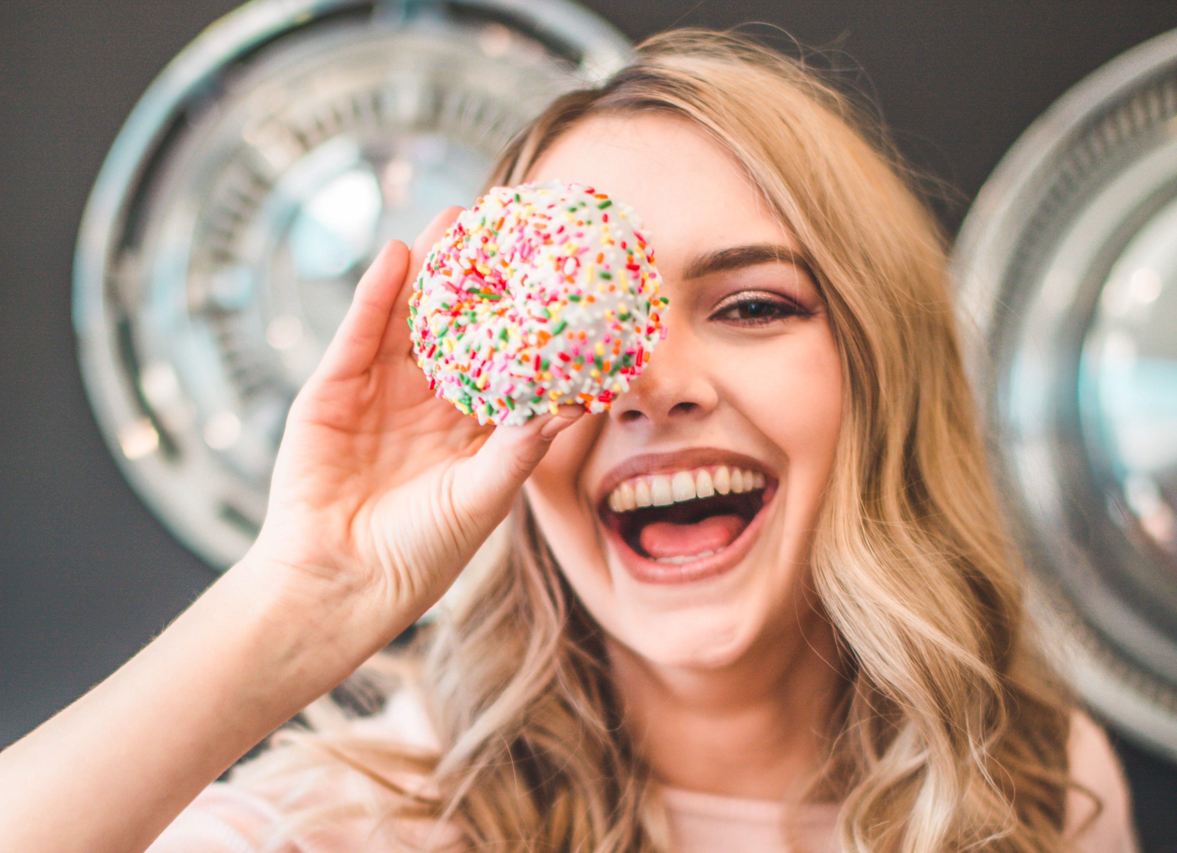 Woman Smiling With Donut