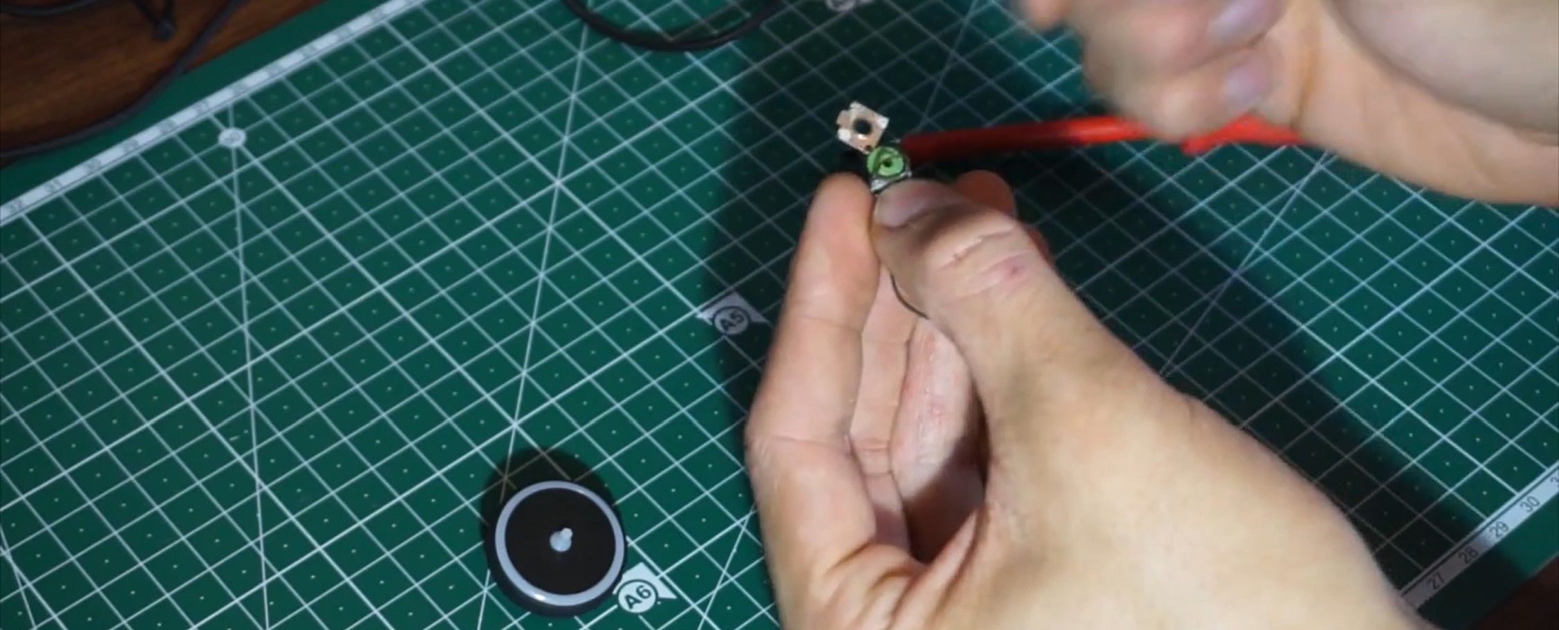 Person Showing the Mouse Encoder Assembly