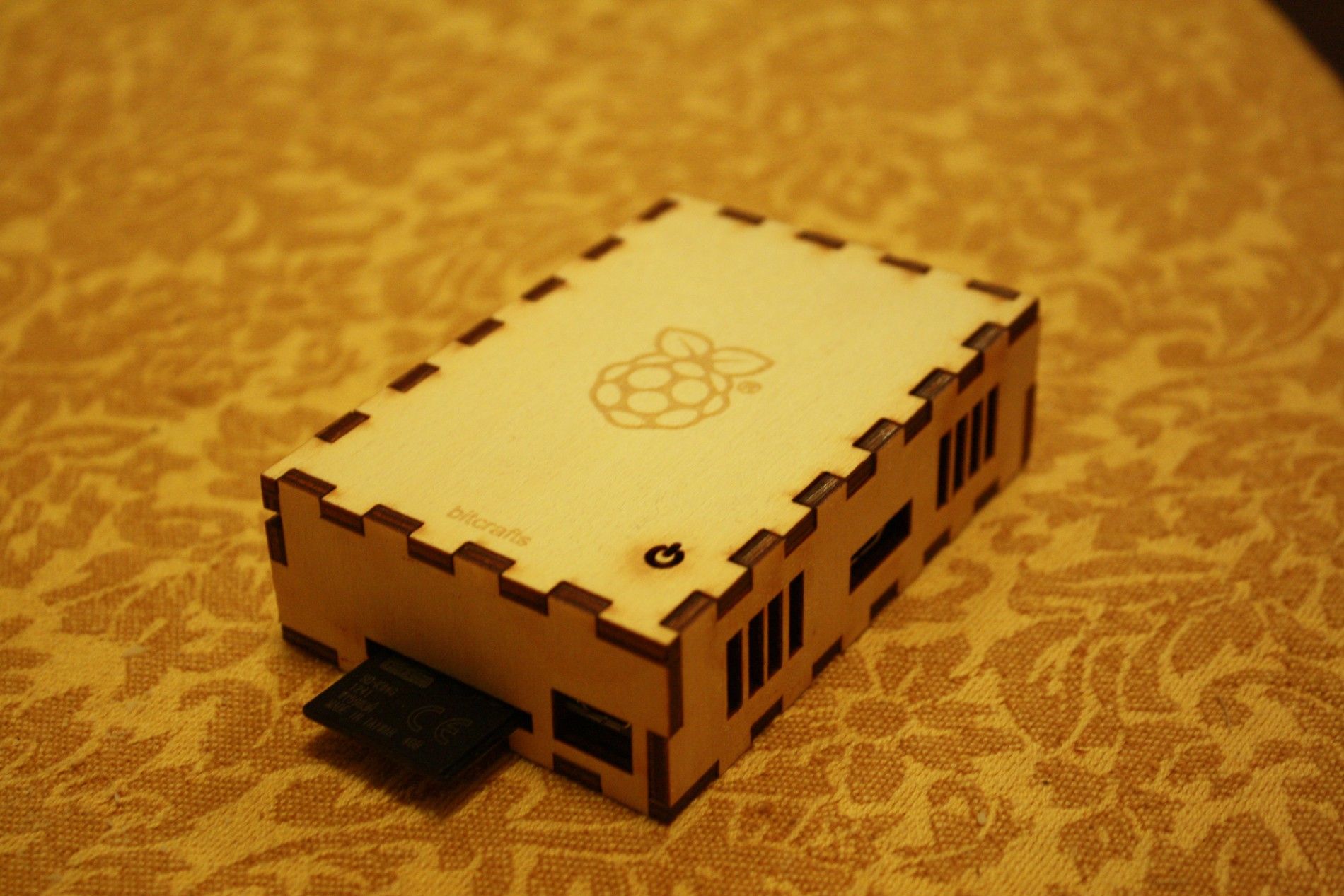 A Raspberry Pi Case with an sd card on top