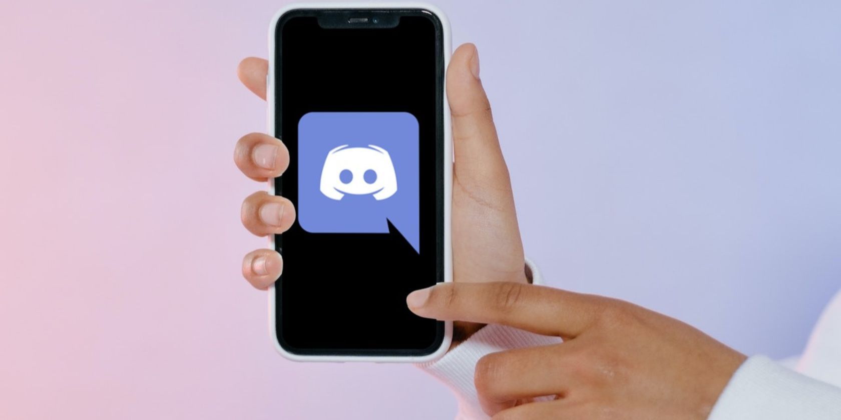 A finger pointing at the Discord logo on a phone