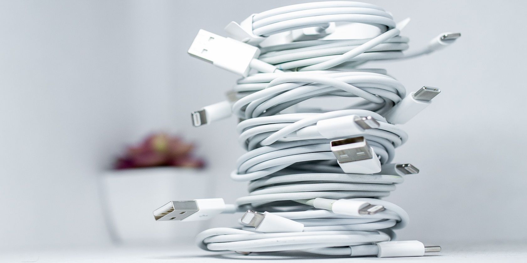 White iPhones and iPads charging cables 