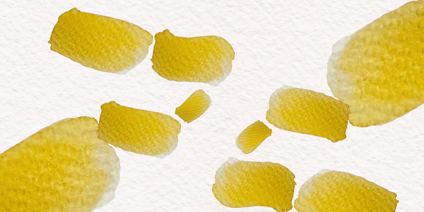 Multiple swatches of yellow watercolour paint.