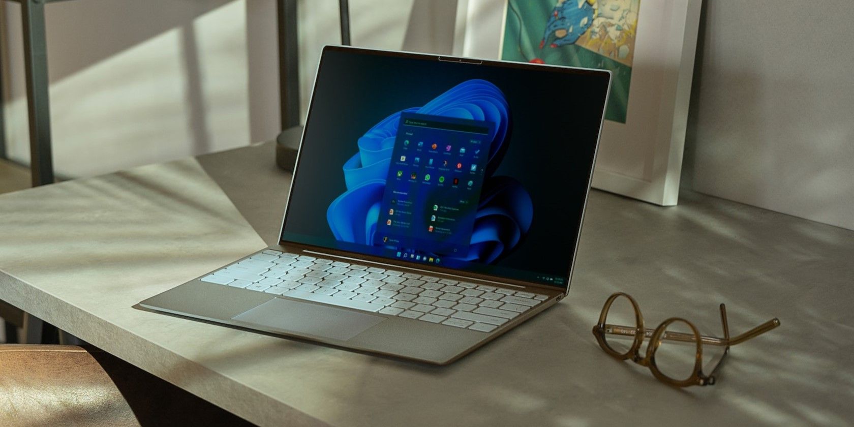 A gray laptop on a wooden table