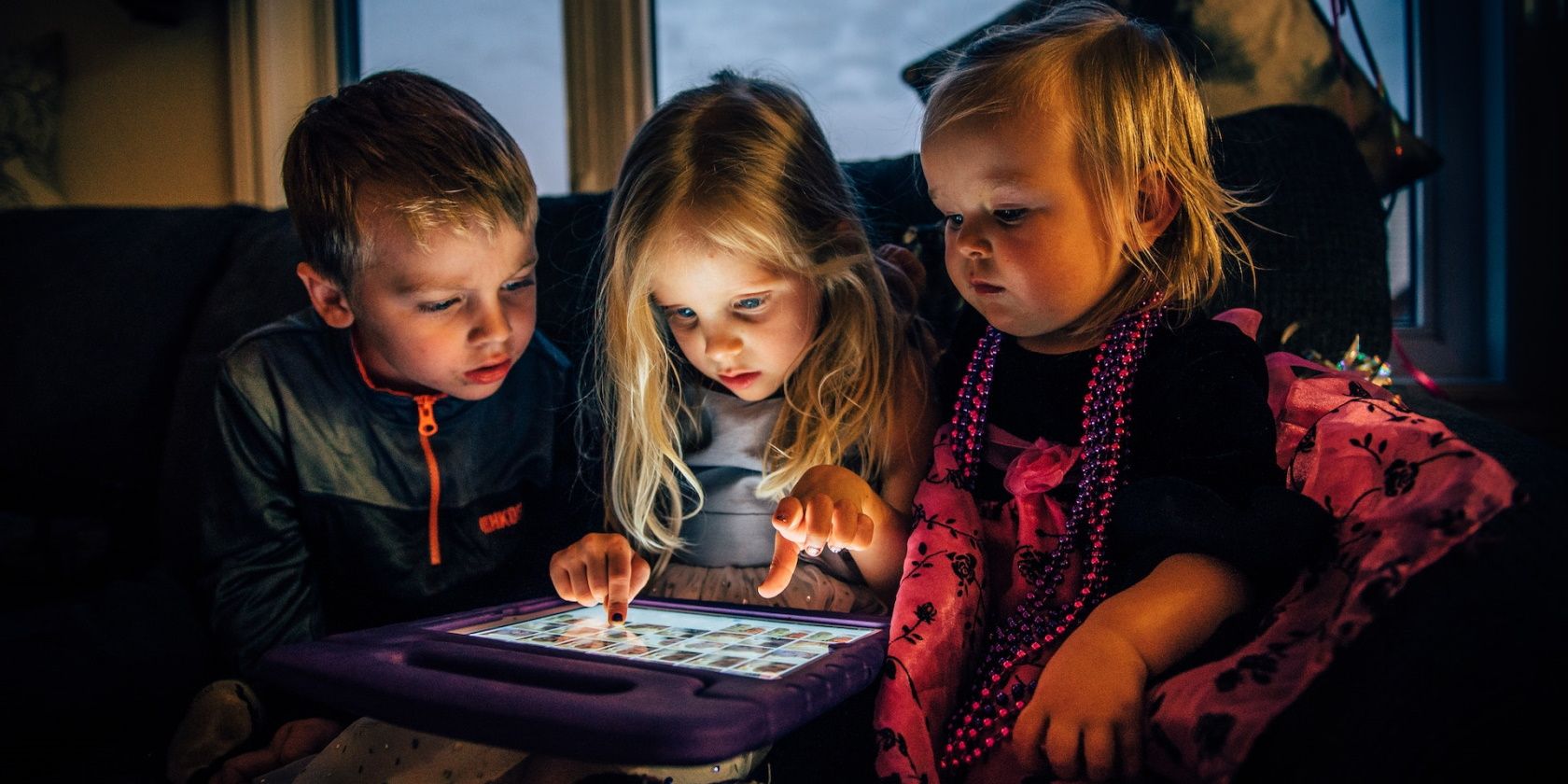 Kids interacting with a tablet