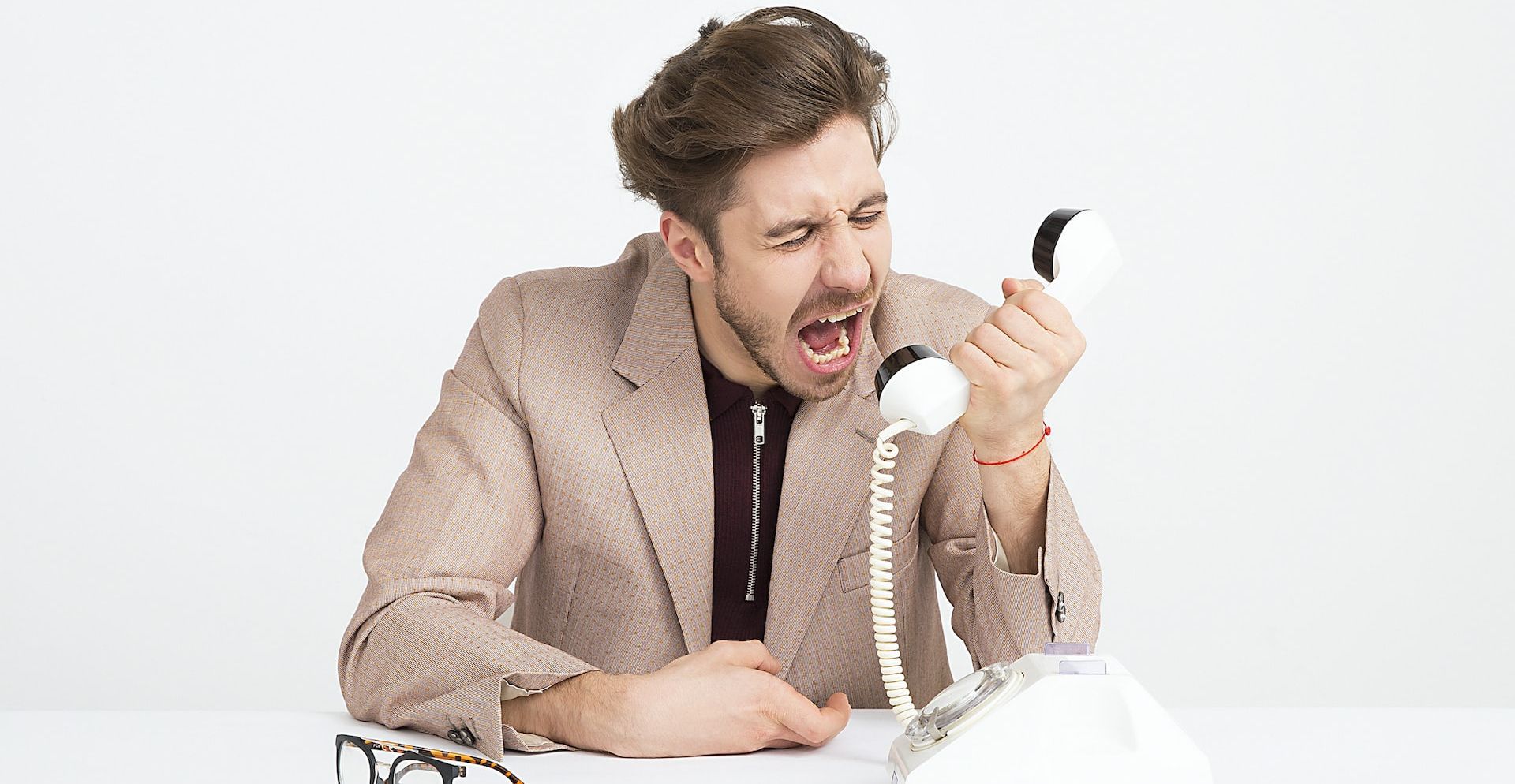 Man Screaming While Attending a Phone Call