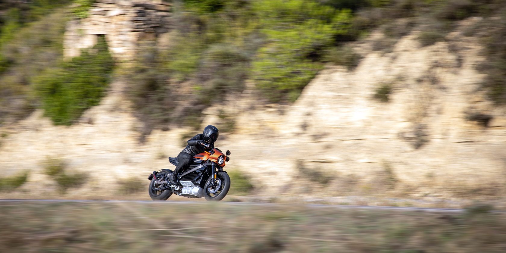 Orange Harley-Davidson LiveWire on canyon road