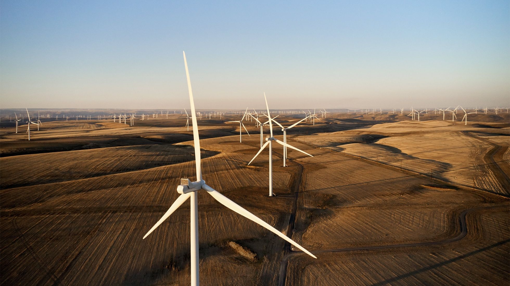 Field wind turbines generating clean energy for Apple