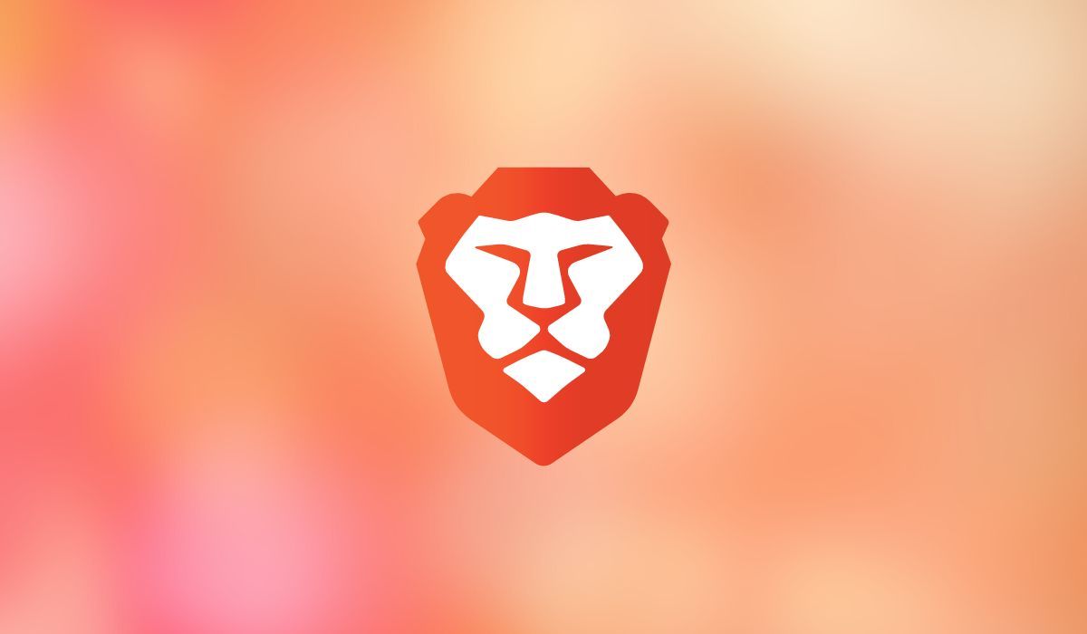Brave browser logo seen on blurry orange background