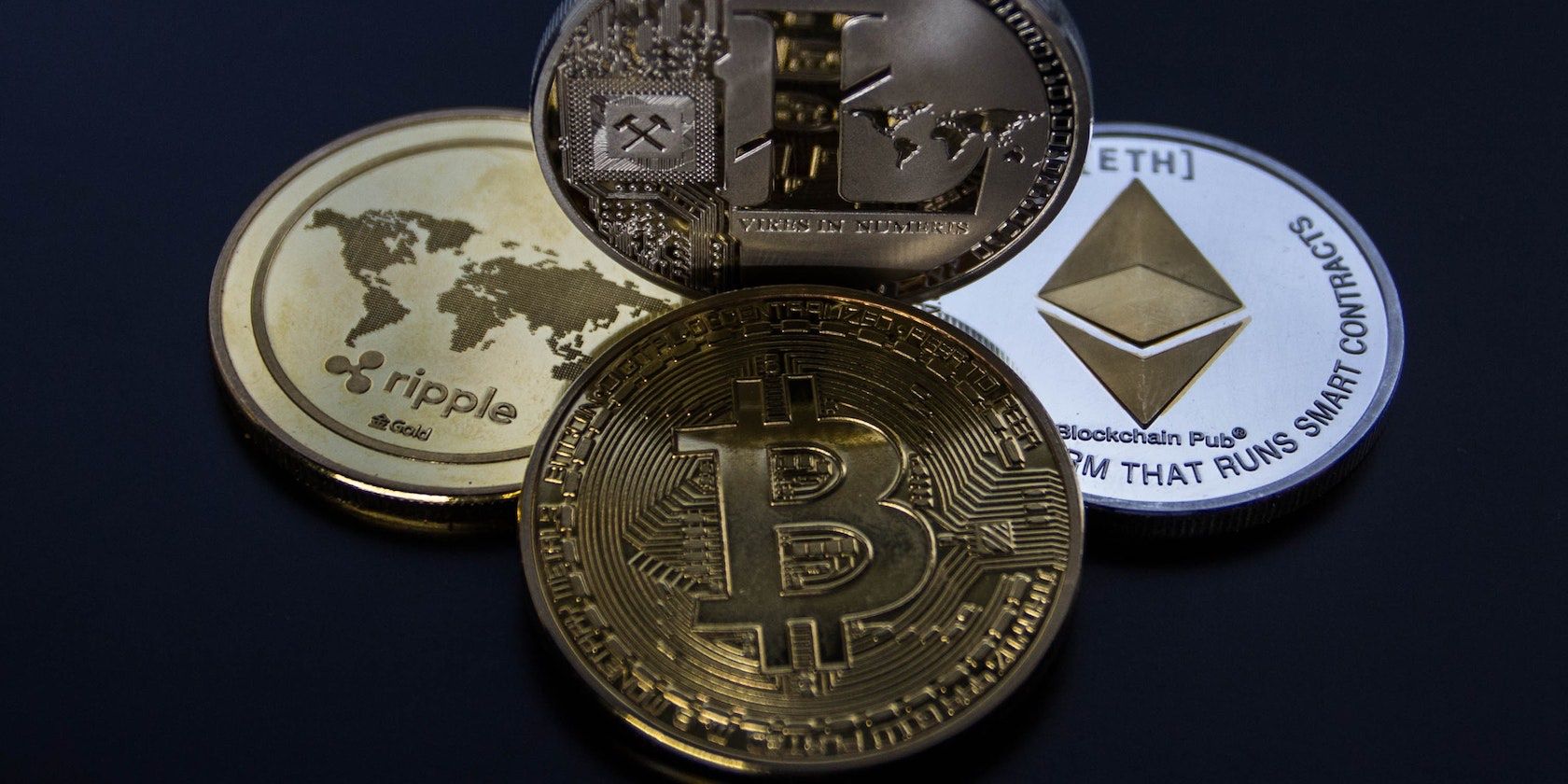 An image showing BTC, XRP, ETH and LTC tokens