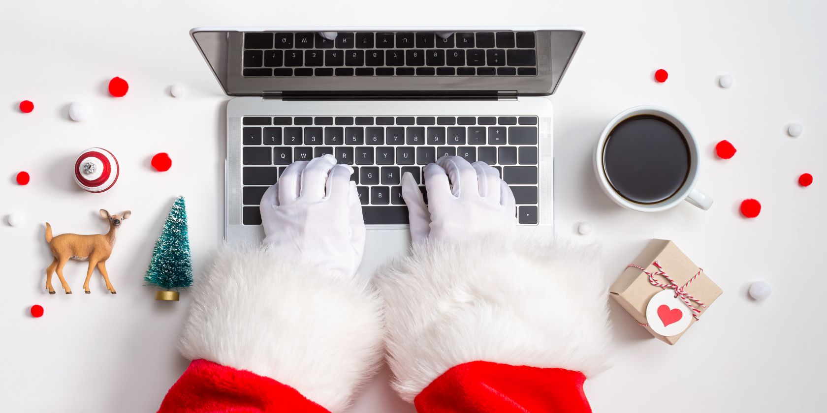 christmas gloves writing on laptop feature