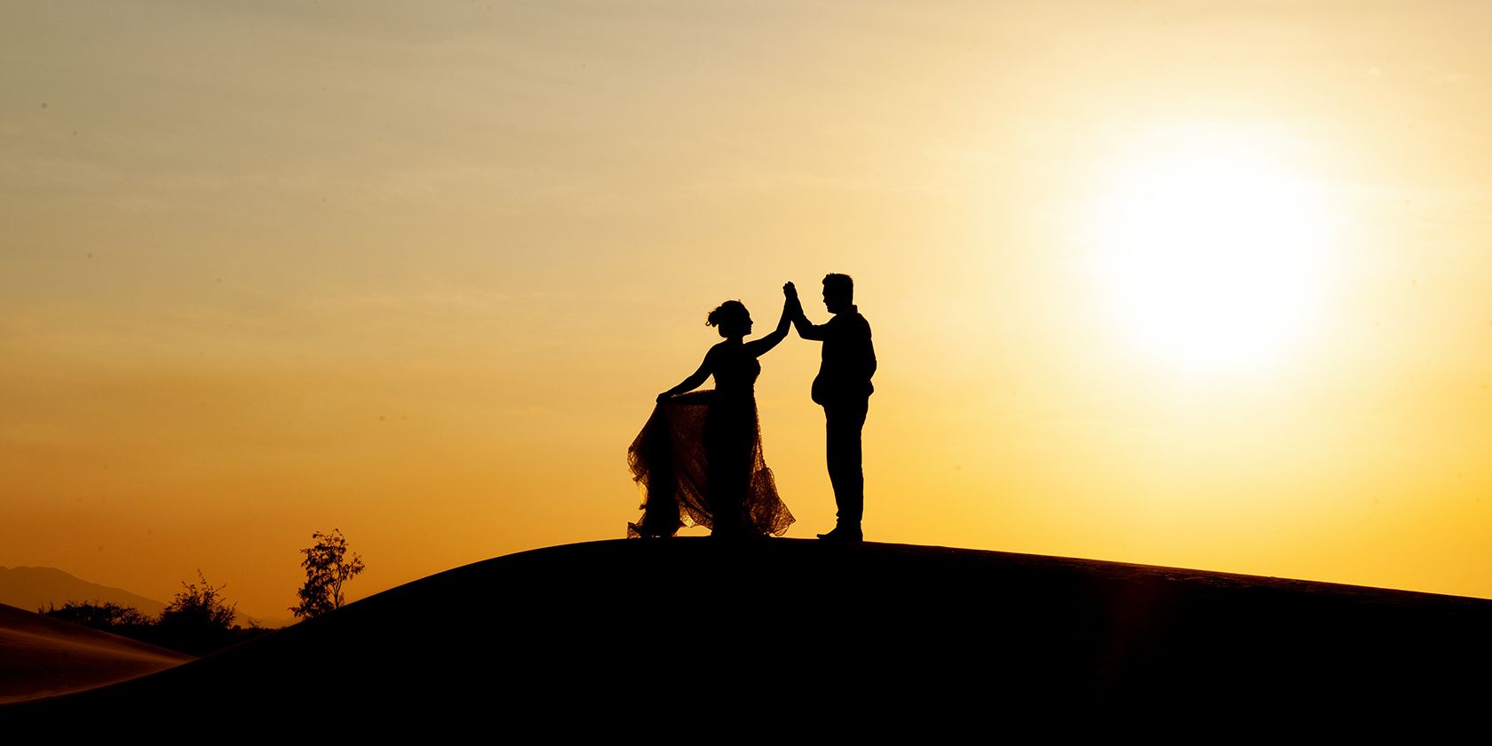 Couple dancing at sunset cover