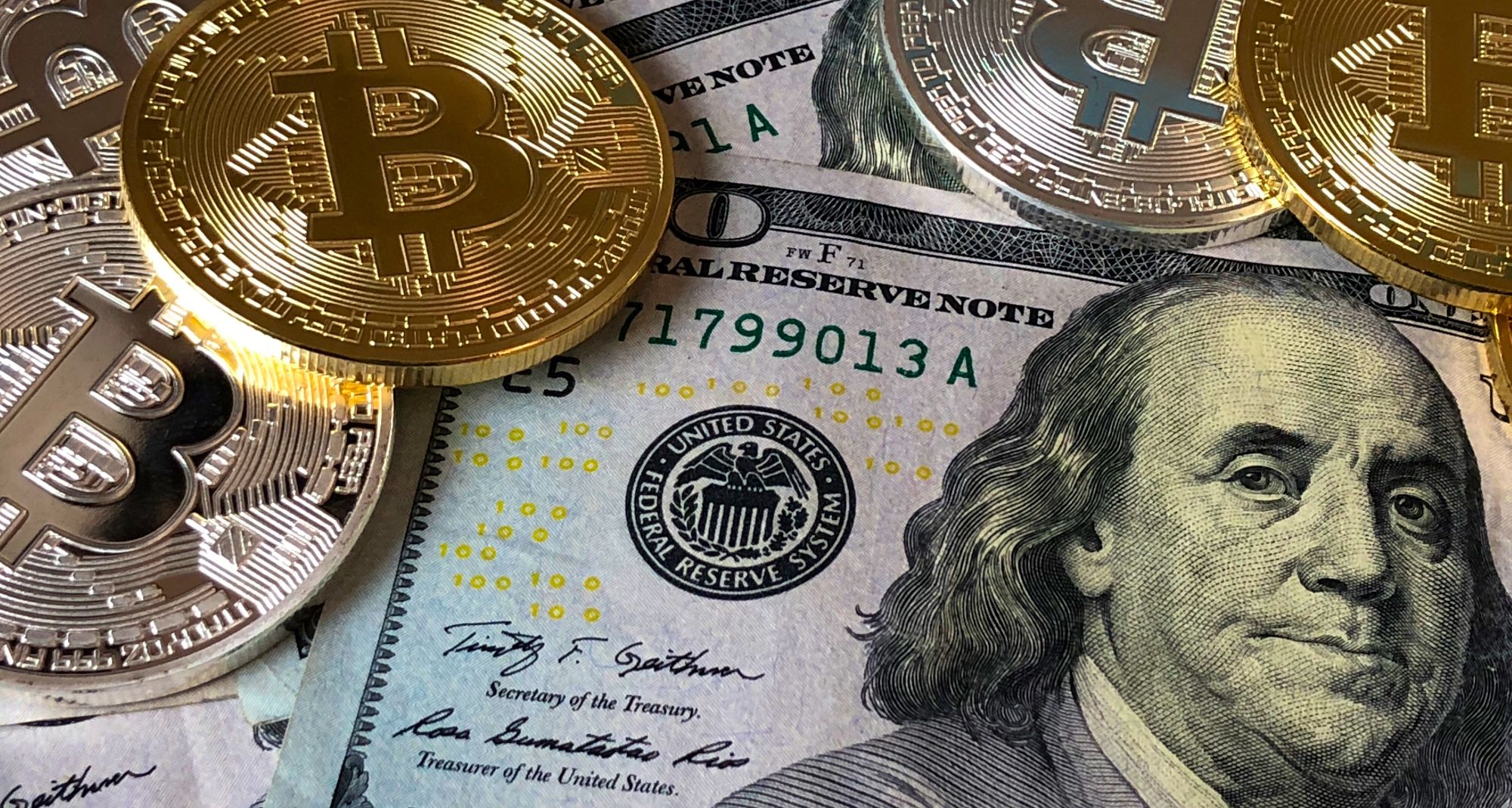 bitcoins on top of us bills