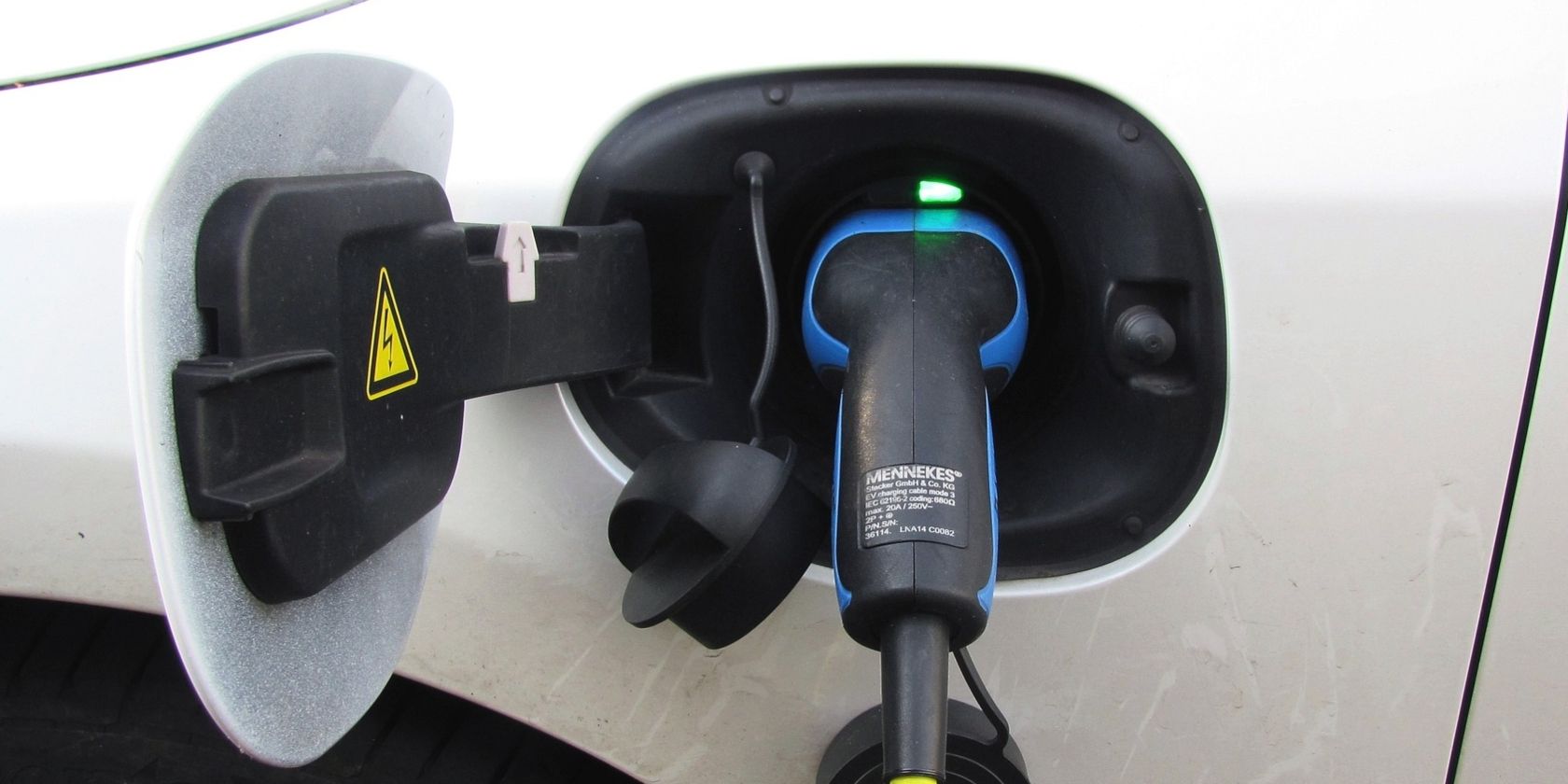 electric car charging port with cable connected