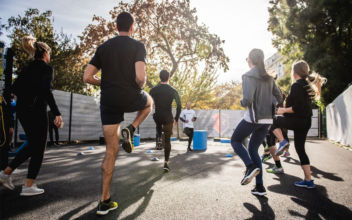 A group of people doing cardio on the road