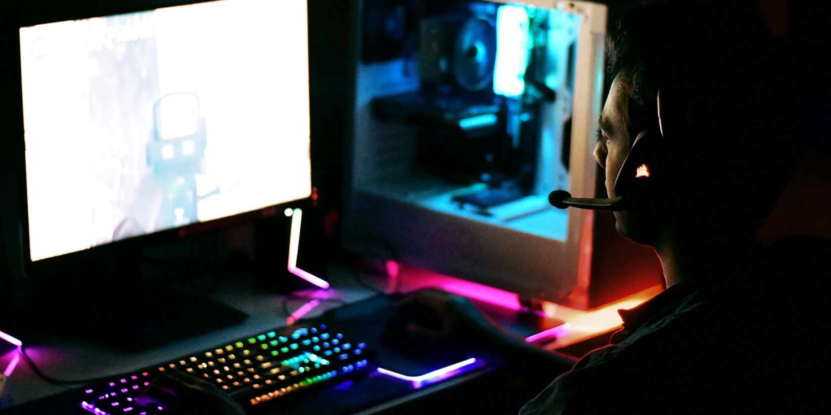 a man playing a game on a PC