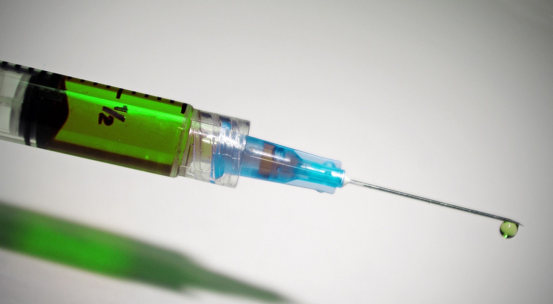syringe containing green liquid