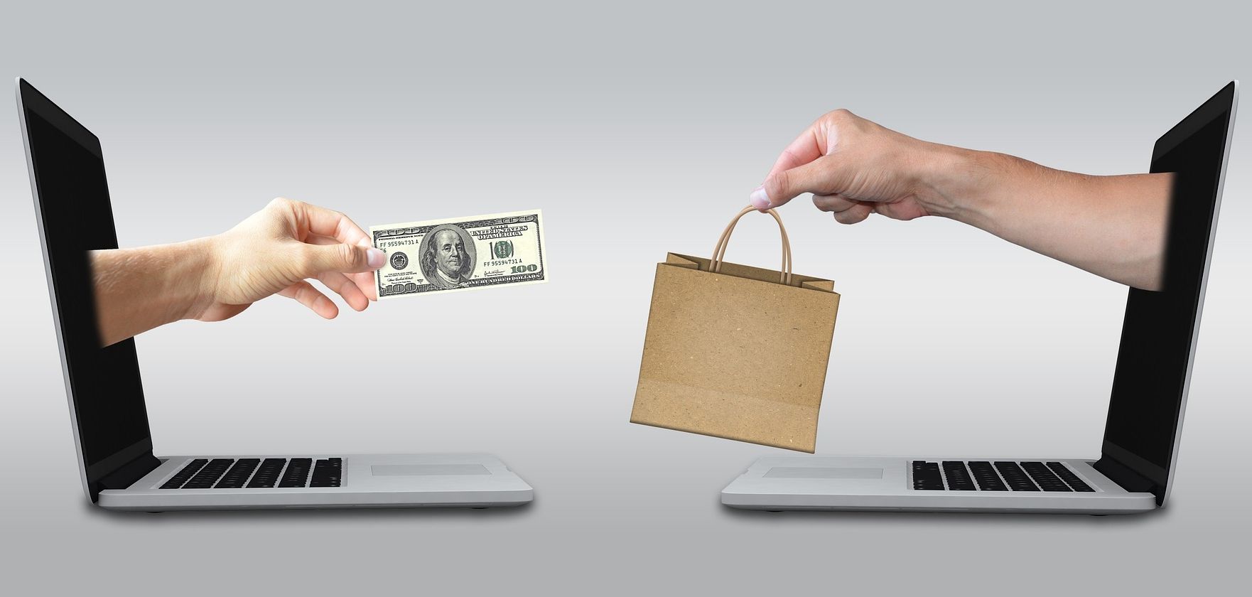 two laptops facilitating shopping transaciton