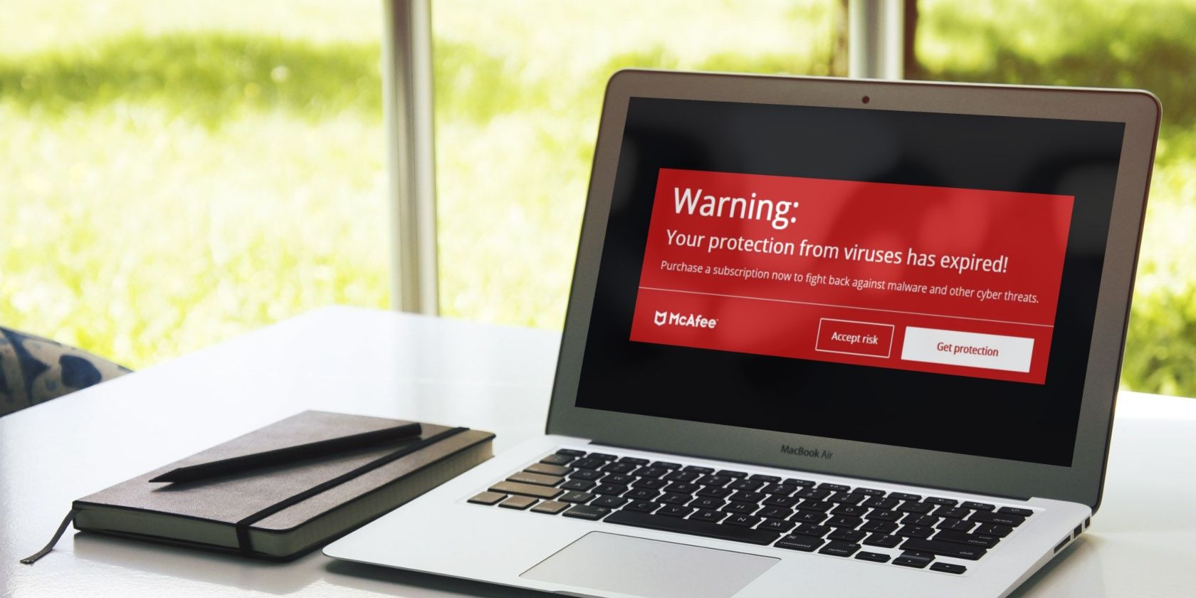 Mockup of Laptop Showing Pop-up of McAfee Fake Subscription Expiry