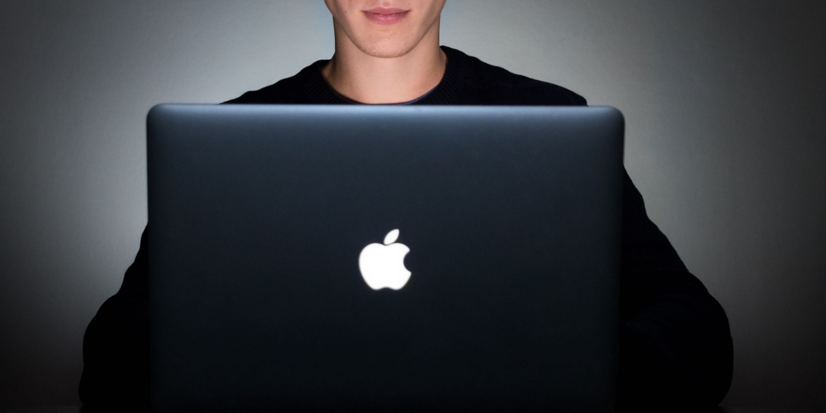 photo of a person working on macbook