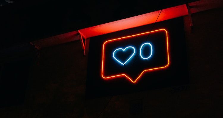 Neon lights with a heart indicating zero followers