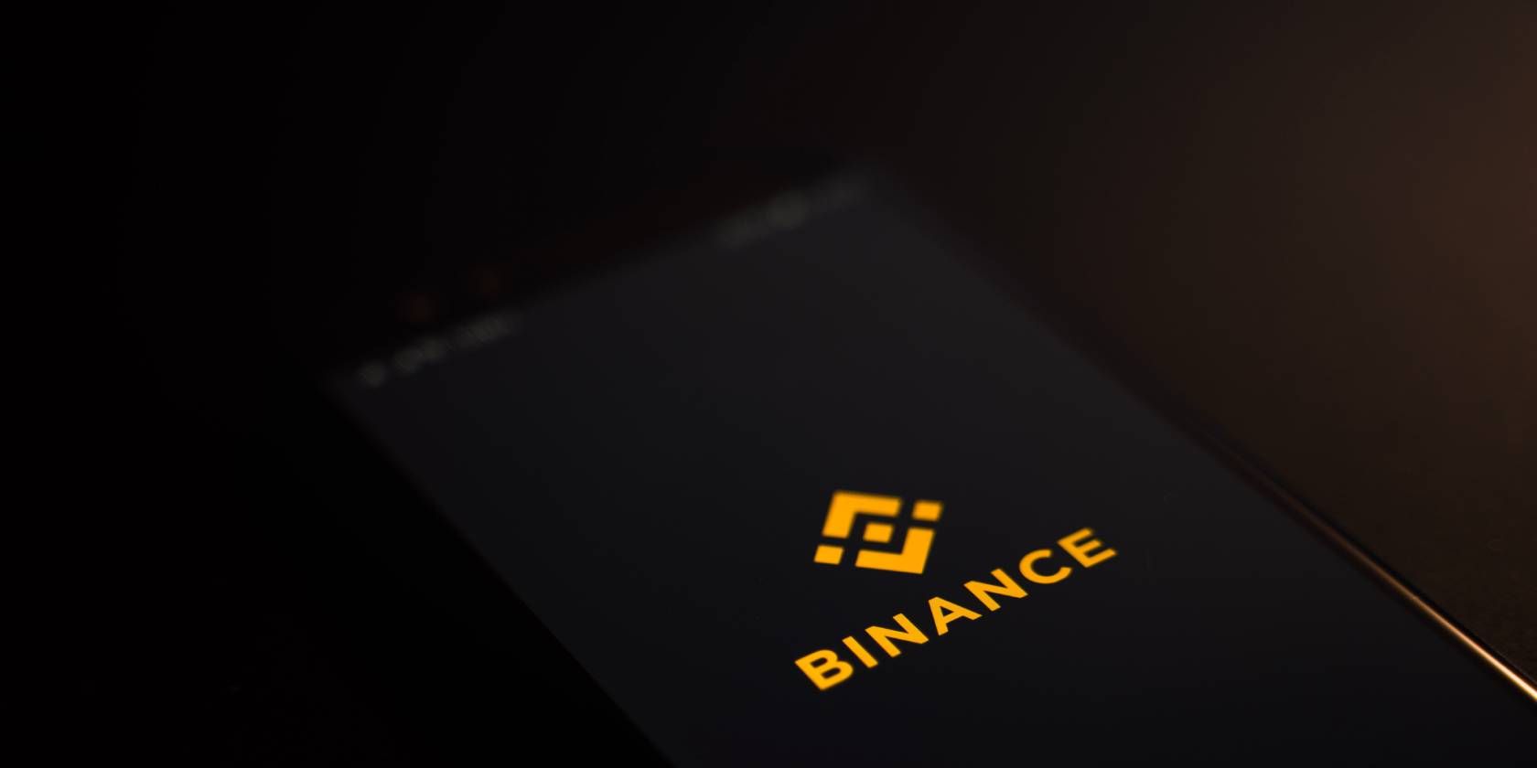 picture of a phone with binance on its screen