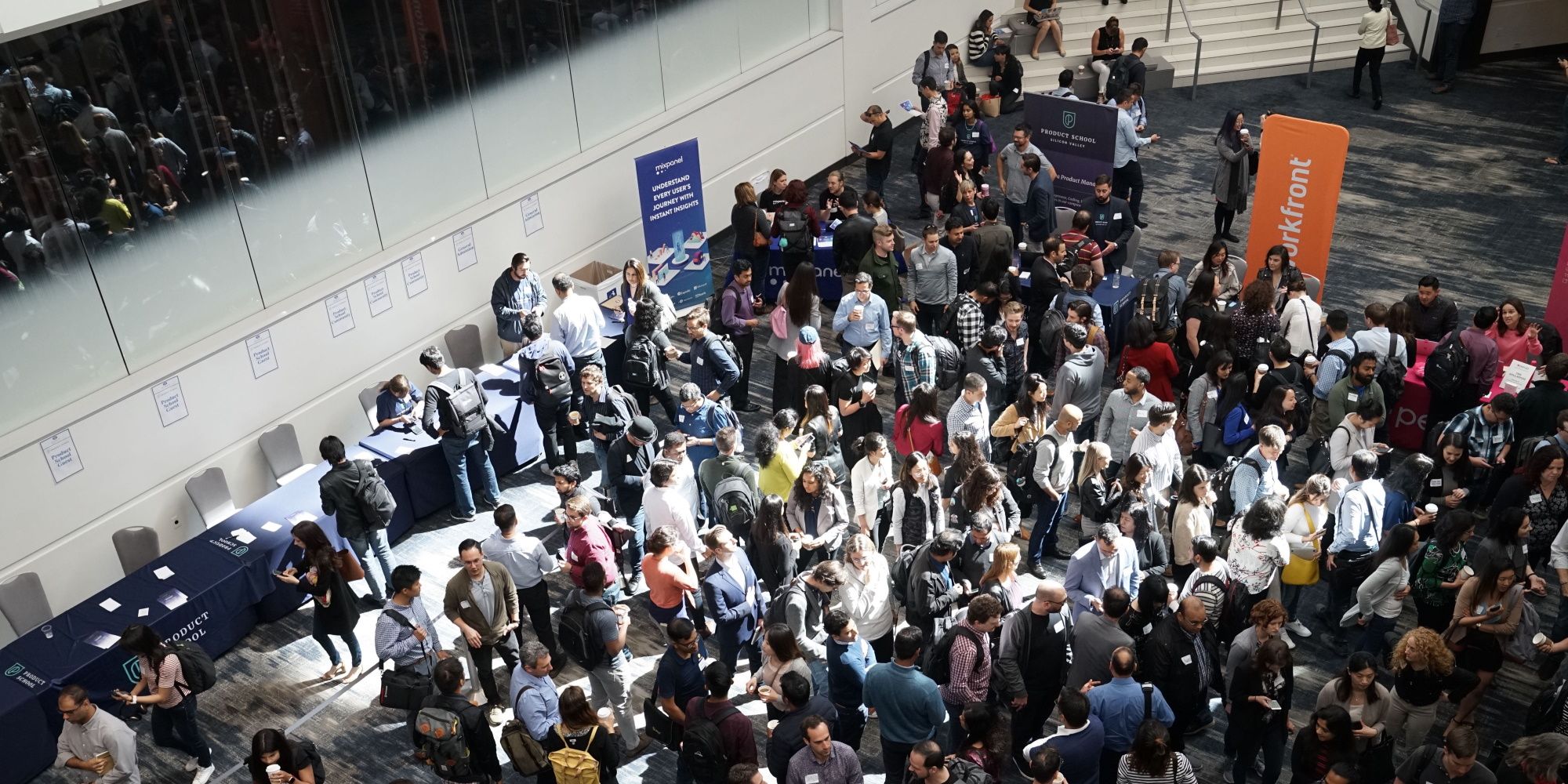 Crowd of people mingling in a conference event