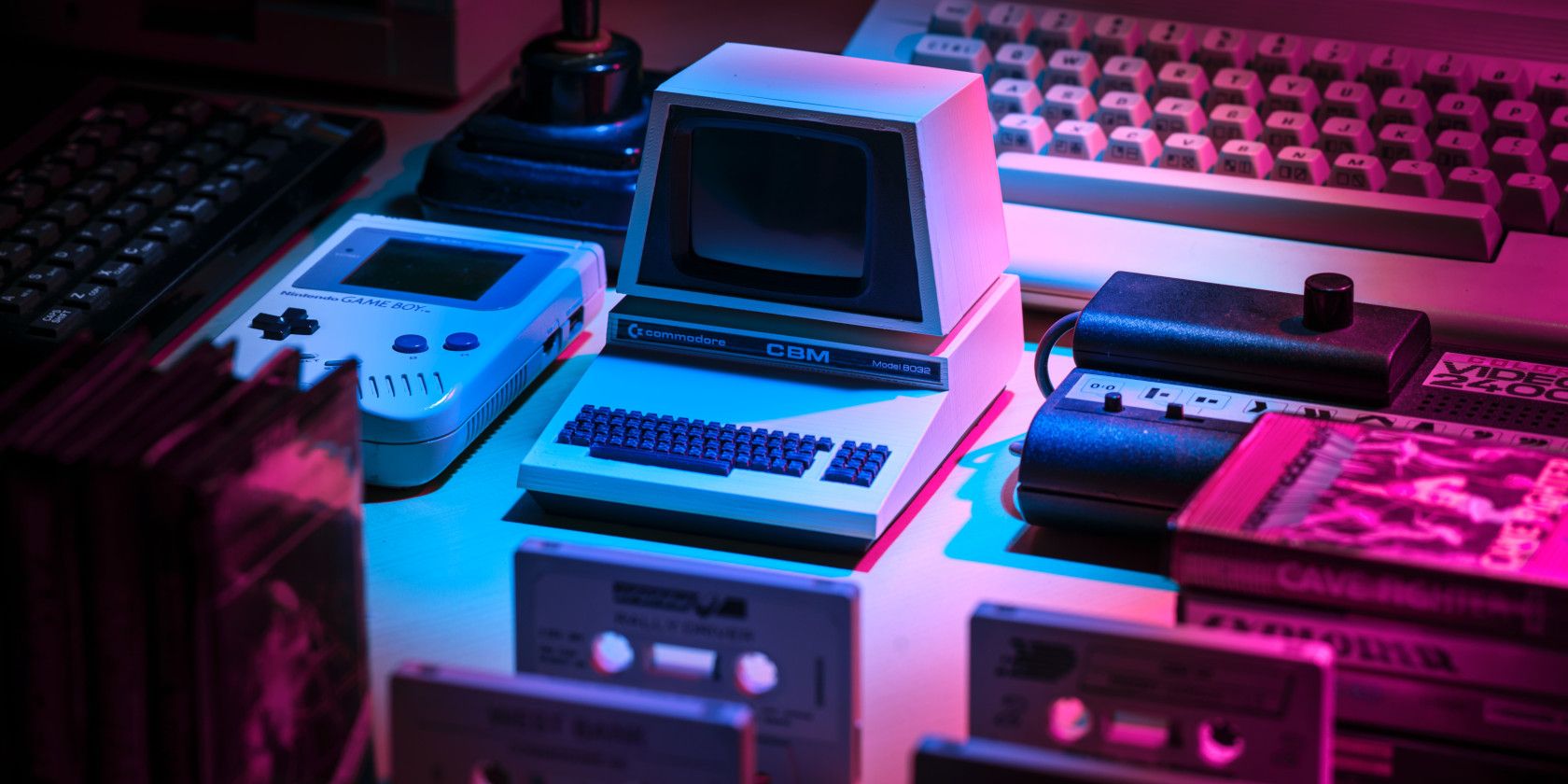 retro consoles and games on table