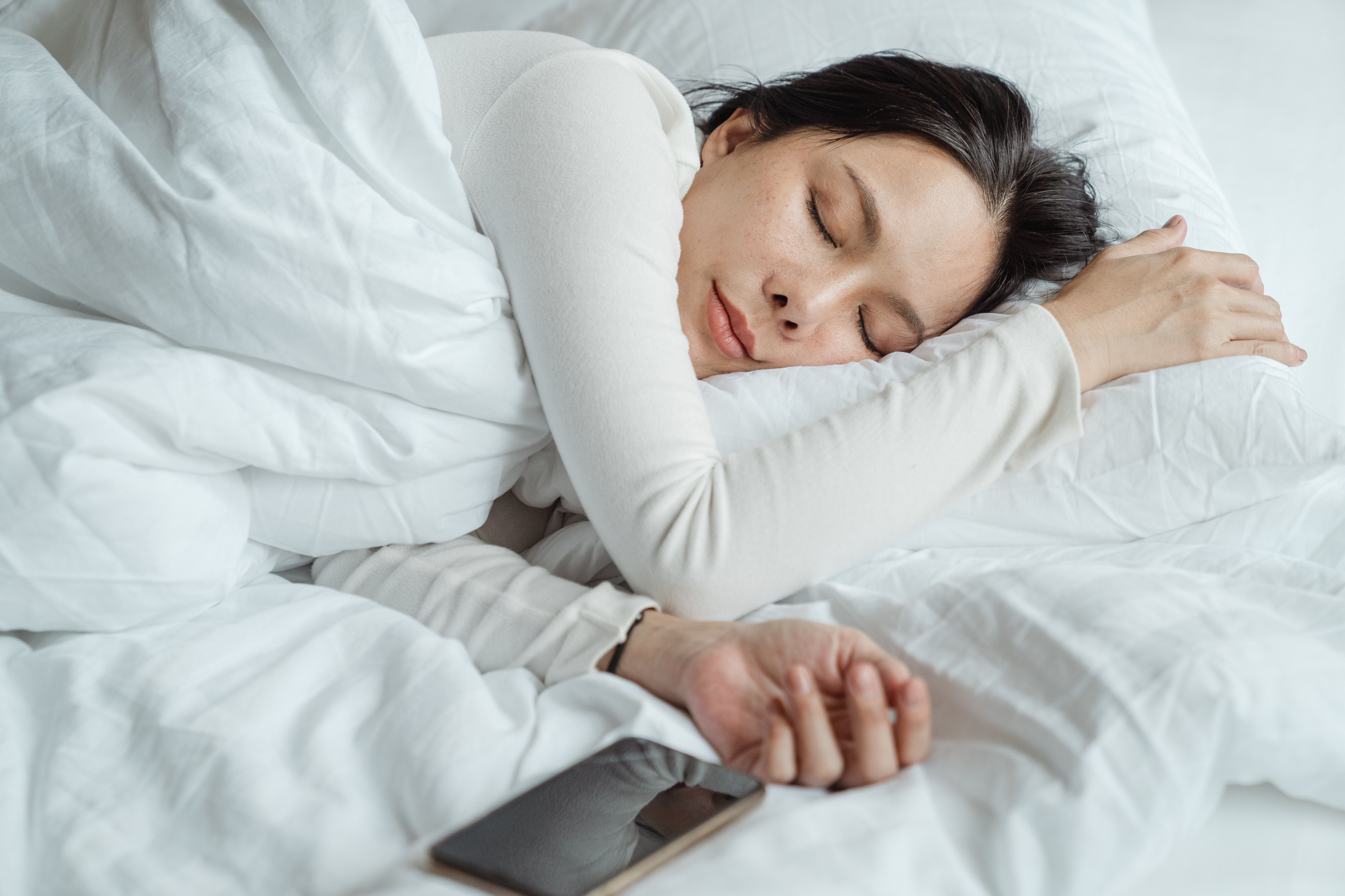 woman sleeping to naturally boost energy