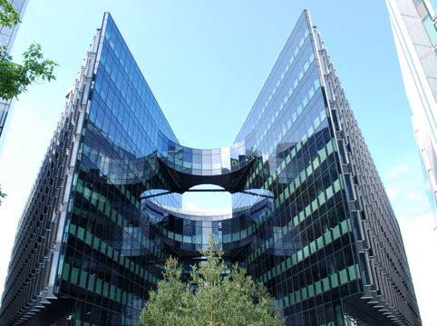 Smart glass building with symmetrical mirrored facades