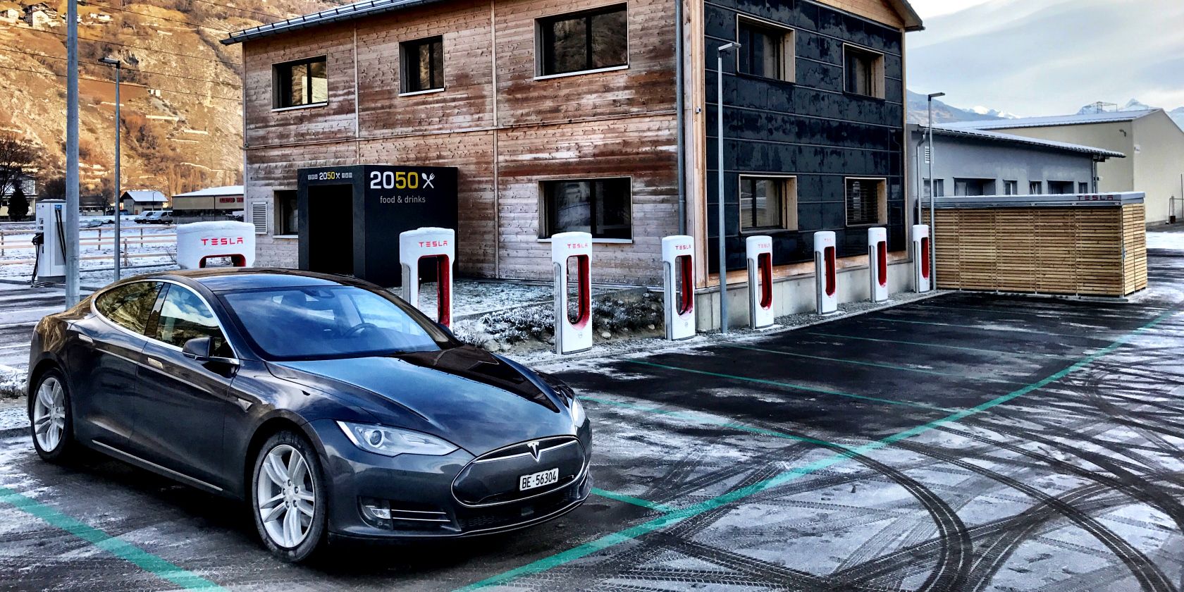 tesla supercharger stations in a row with tesla charging function