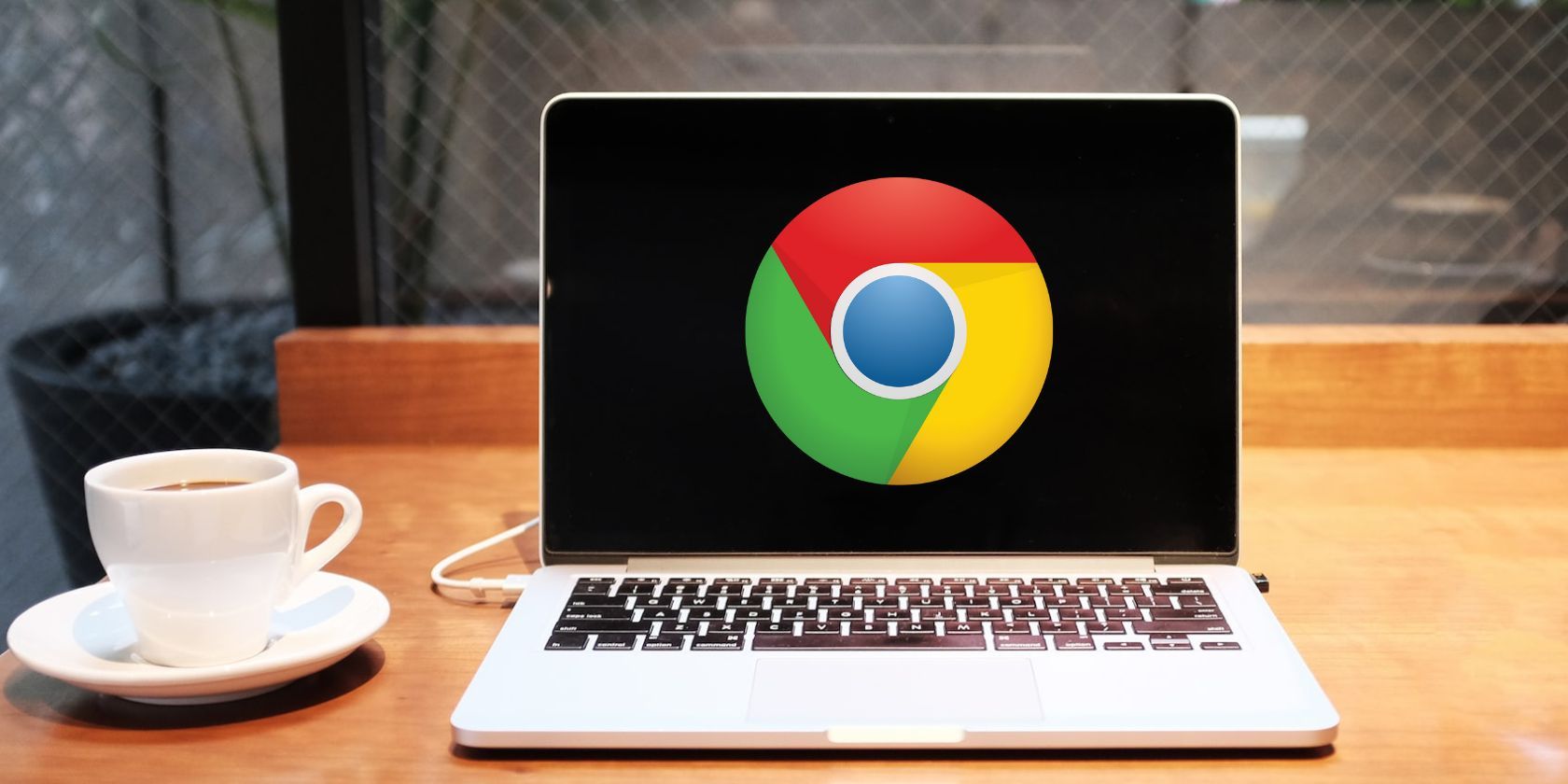 A silver laptop with a Google Chrome logo on screen