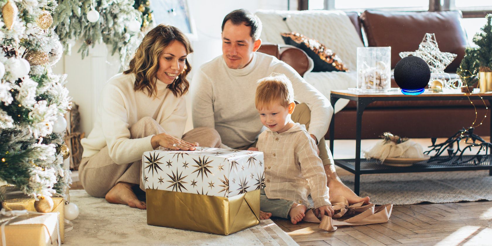A Family Next to a Christmas Tree with Amazon Echo on Table