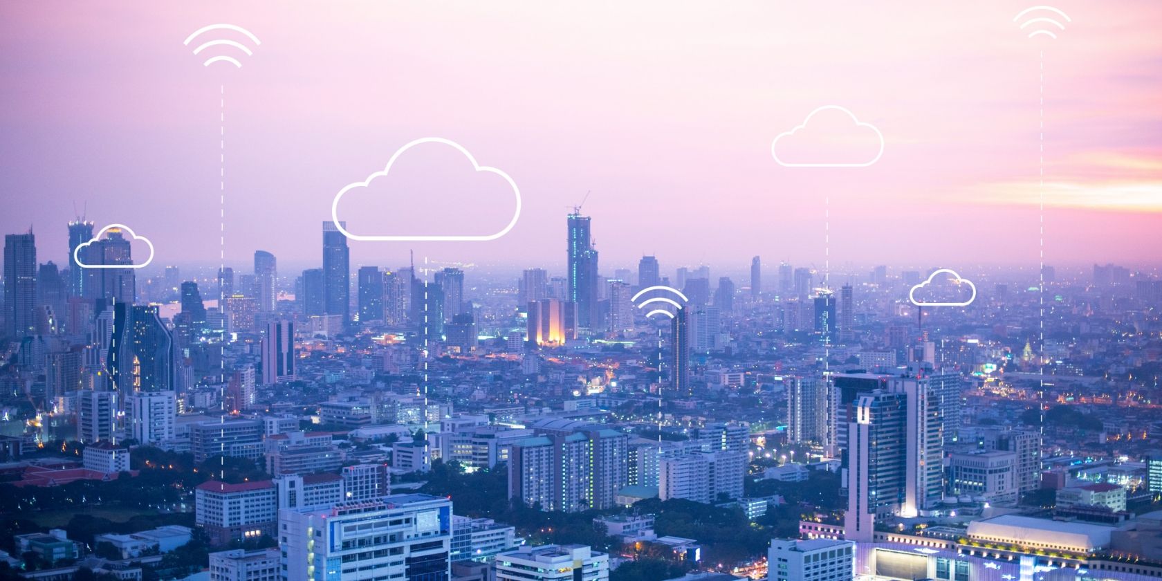 City with connection and cloud logos hovering above buildings