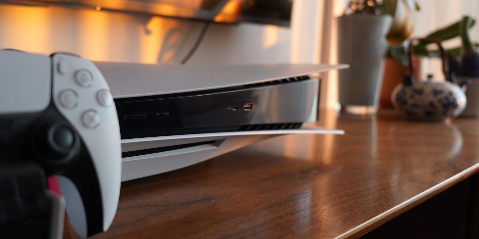 Close up of a PlayStation 5 console on a tv cabinet