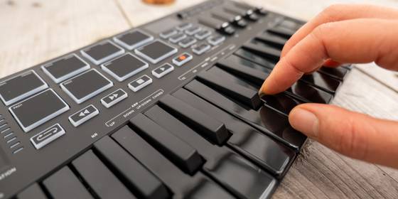 Donner DMK25 Pro Mini Midi Controller: Knobs, Sliders, Keys, and Pads Galore