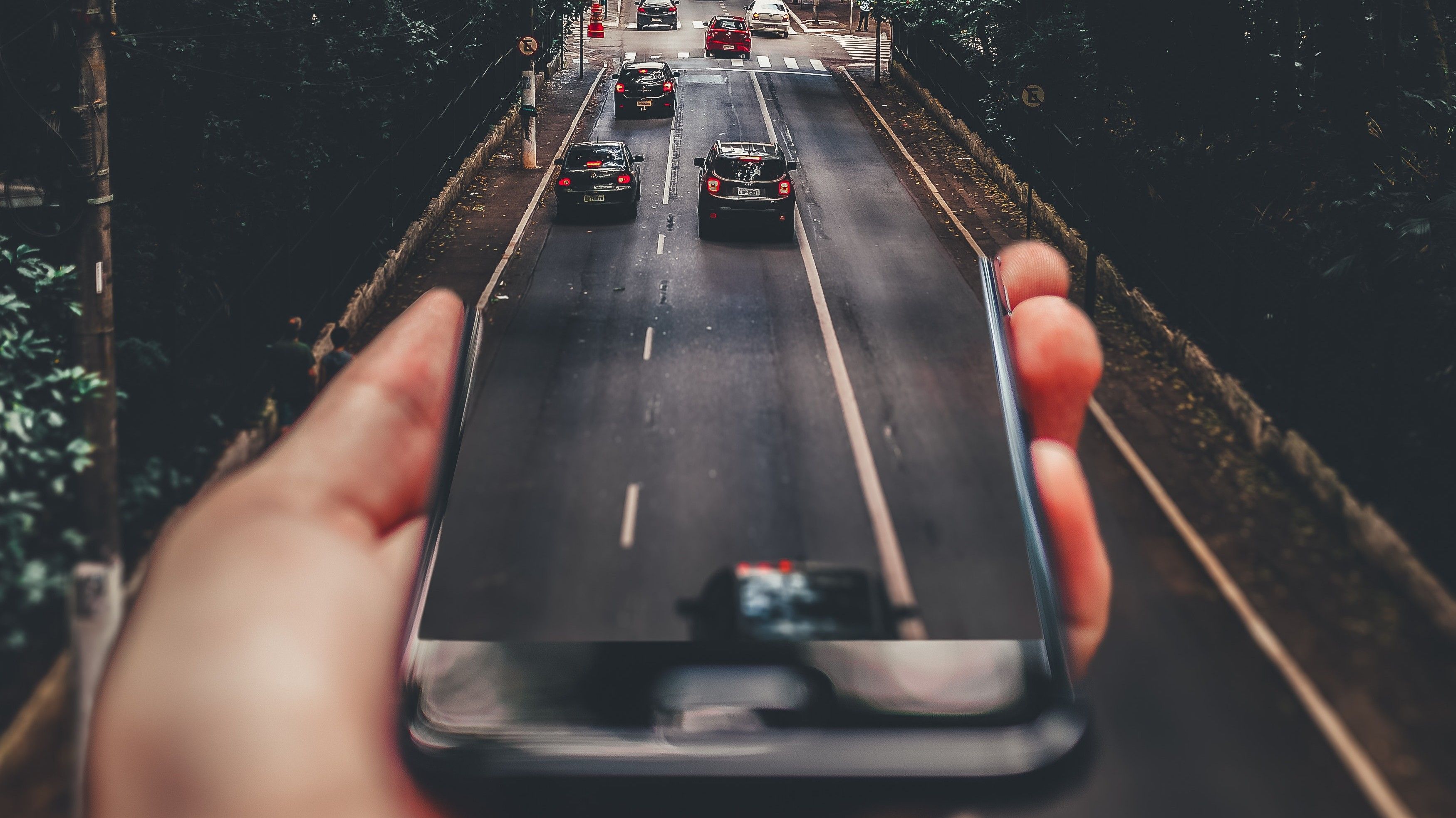 Forced perspective cars and road on the phone screen