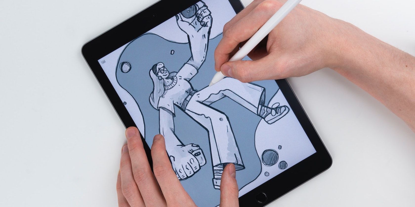 A hand coloring an illustration on an iPad using an Apple Pencil