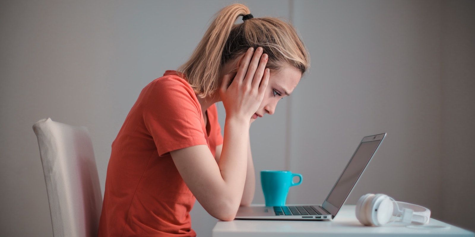 A Frustrated Woman Looking at Her Laptop 