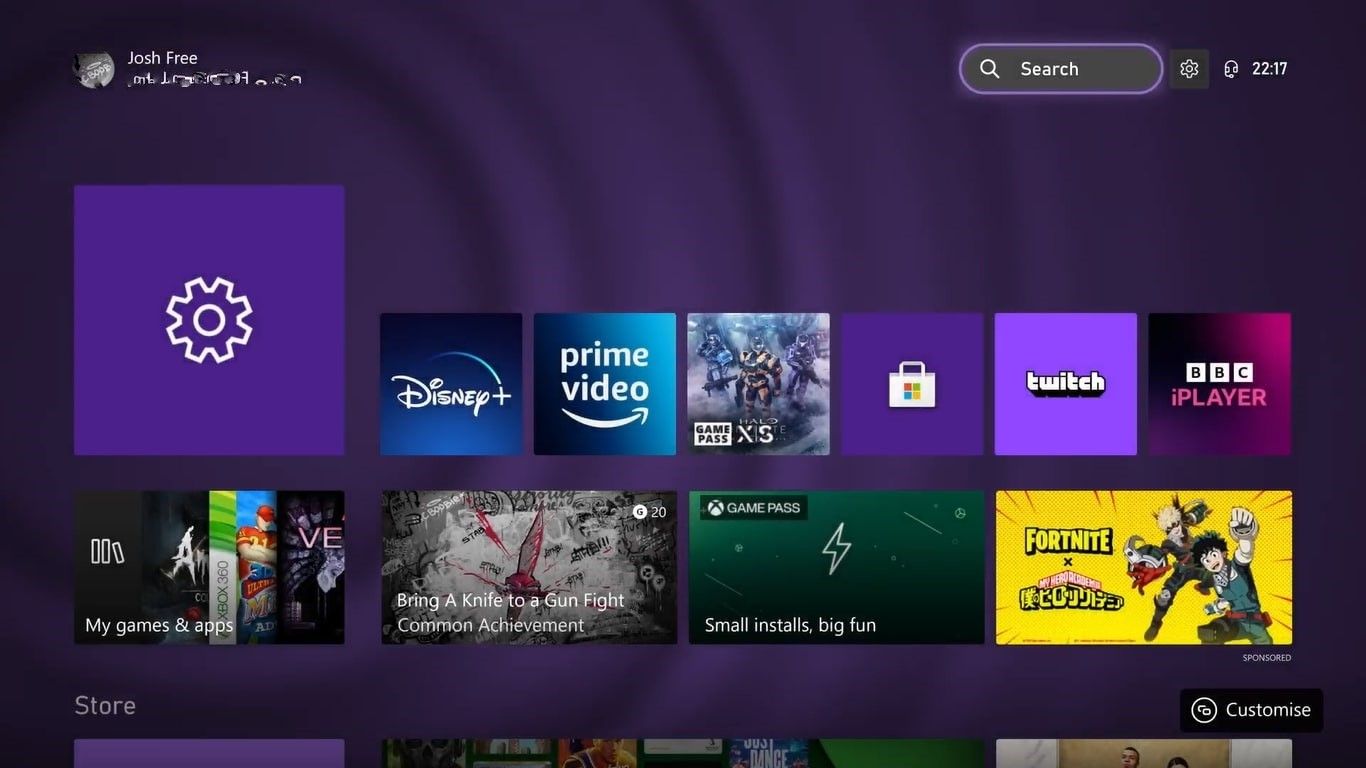 A screenshot of the Xbox Series X home screen with the search bar and settings shortcut highlighted 