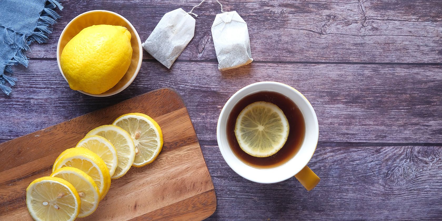 Hot tea and sliced lemons