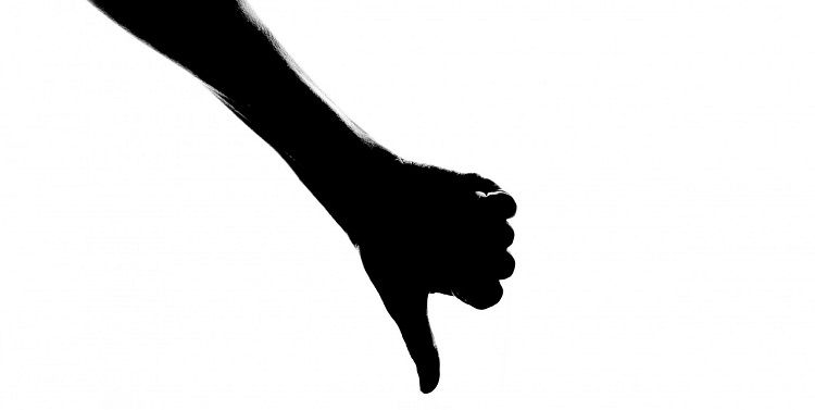 Image of a silhouette of a hand with the thumb pointing down