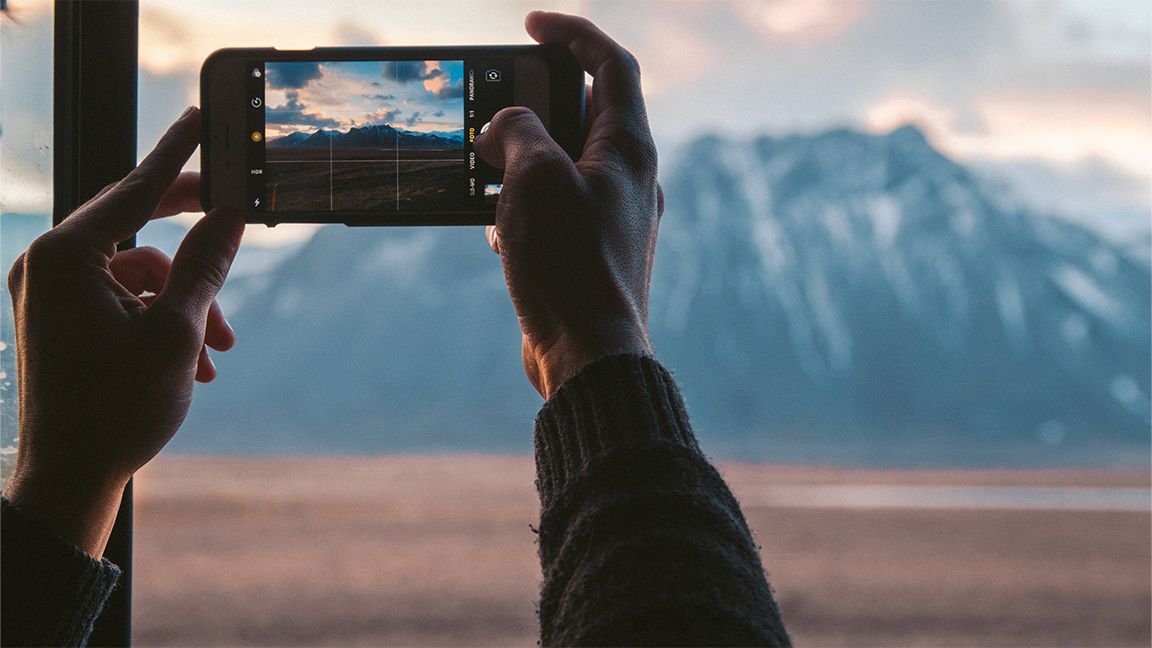 Taking a photo of mountains with an iPhone