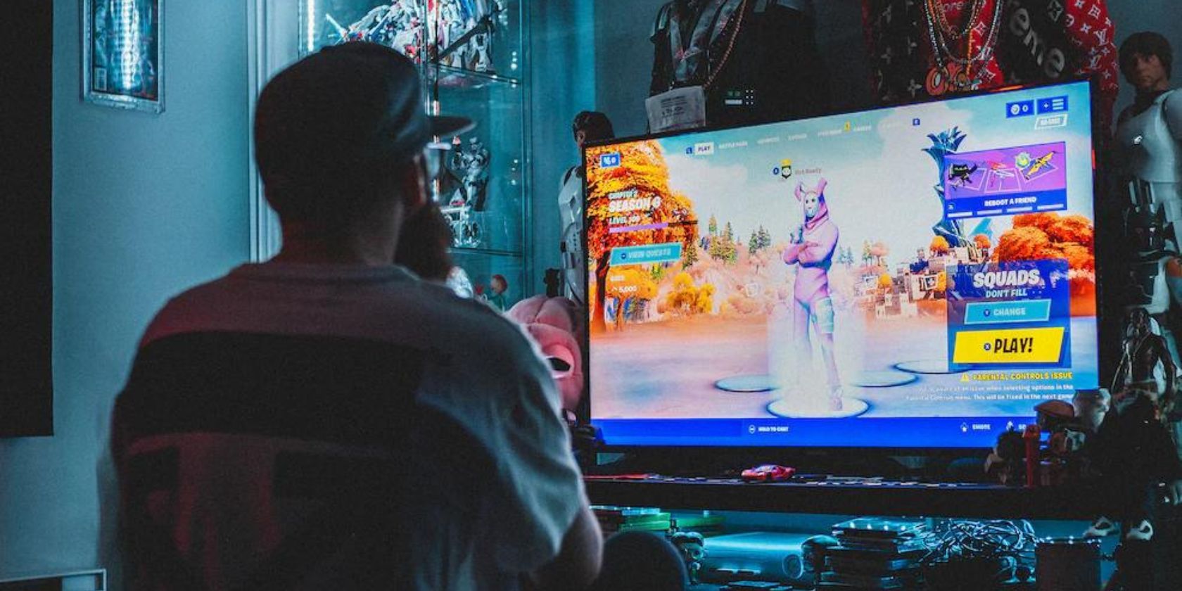 Man playing Fortnite in the game room
