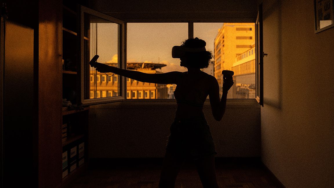 Woman using a VR headset in an apartment