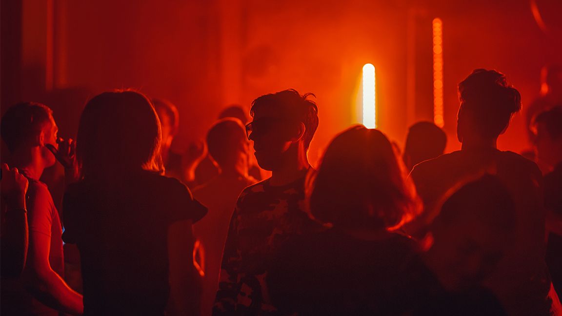 People in a dark nightclub