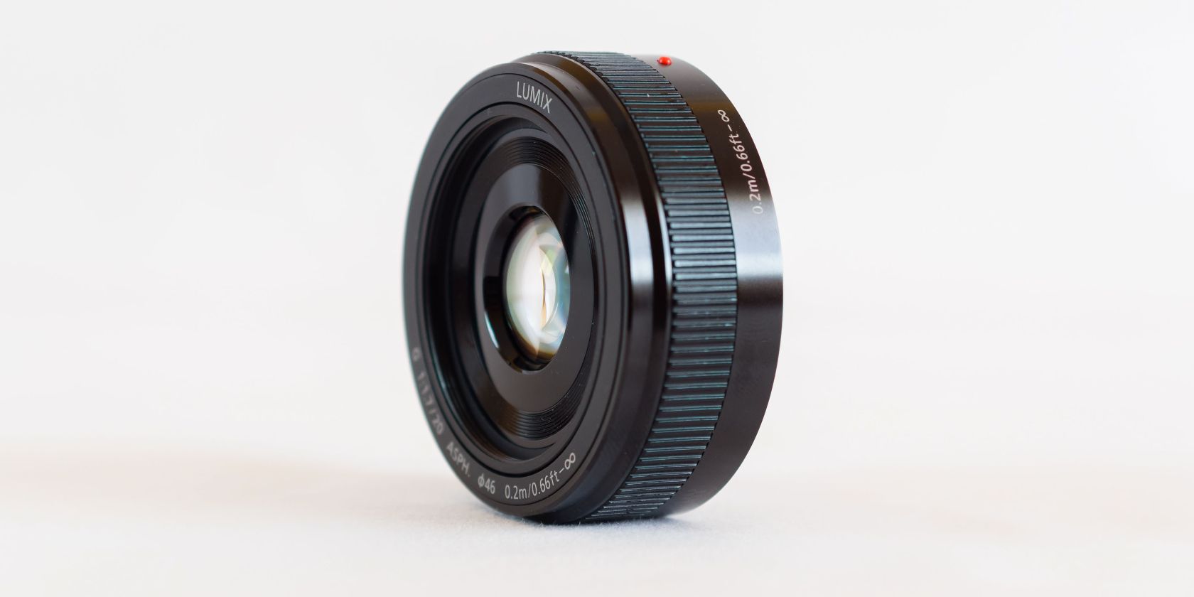Black pancake lens in front of white background