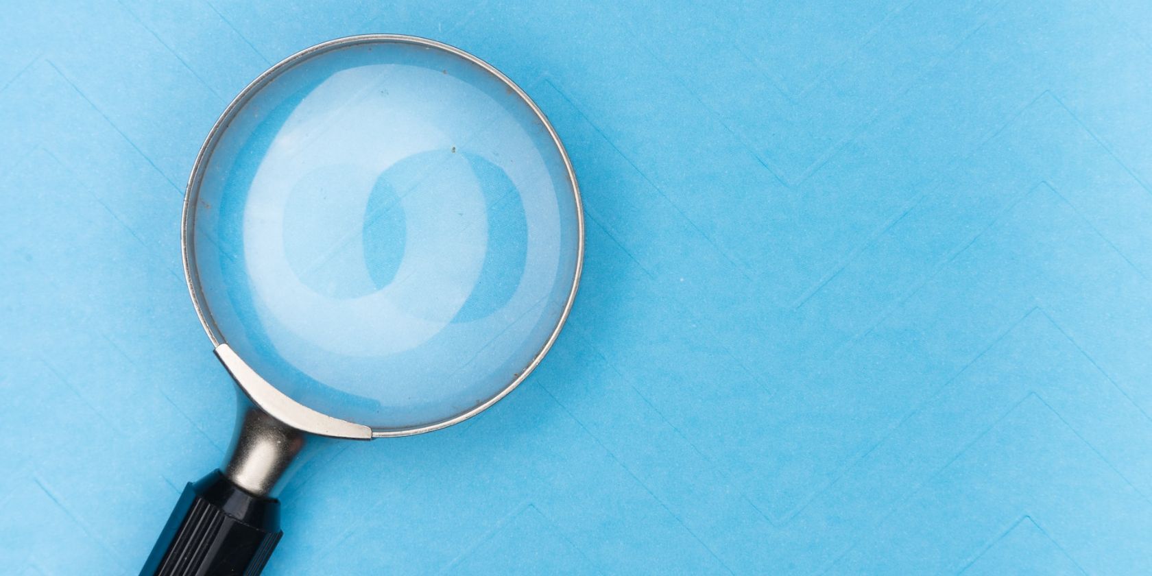 magnifying glass on blue background