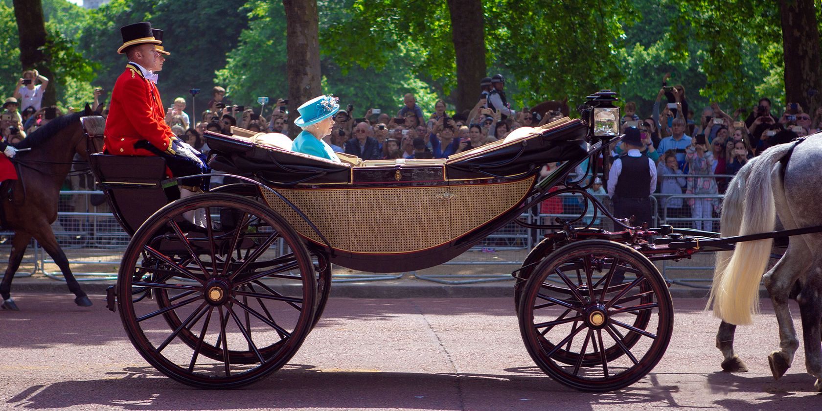 Queen Elizabeth II riding a carriage