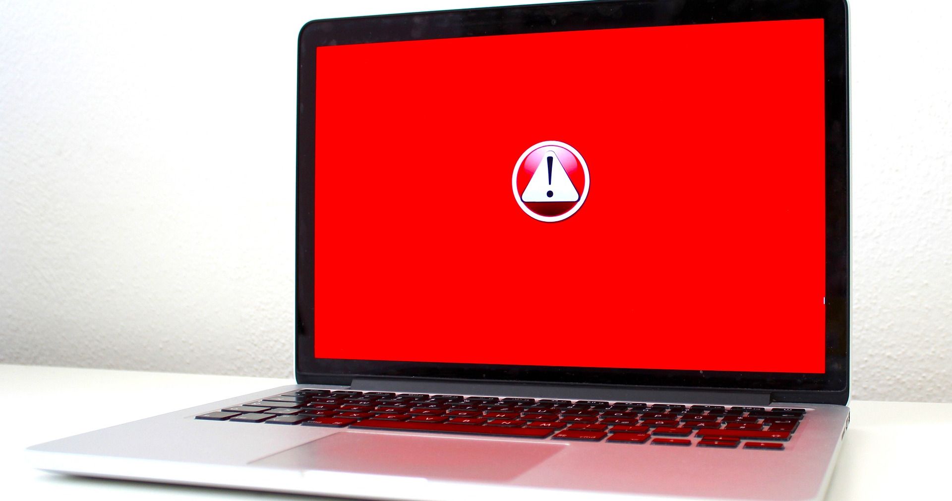 red error logo on laptop